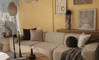 Modern M1 three seater modular sofa in a bright living room with yellow walls