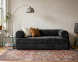 S8 Sleeper Sofa Bed in a living room, styled with two cushions, a rug, and a floor lamp beside it.