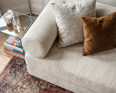 Close-up of the S8 Sleeper Sofa Bed fabric, with two cushions positioned at one end.