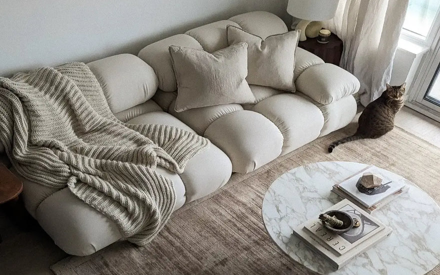 marshbello in a living room, with two pillows