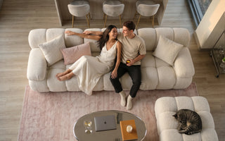 couple relaxing and laughing on marshbello sofa