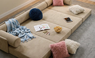 The S8+ sleeper sofa set up for lounging and sleeping in a relaxed living space