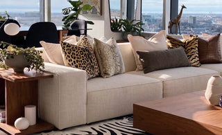 modular sofa with animal print pillows in a living room