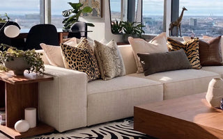 modular sofa with animal print pillows in a living room