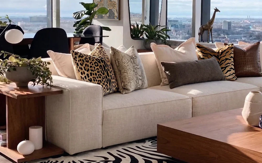 modular sofa with animal print pillows in a living room