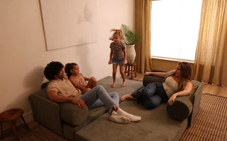 Family comfortably sprawling out on the deep seats of the S8 Plus sofa