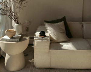 #A stylish living room with modern decor, featuring a modular sofa and elegant accessories