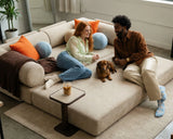 S8 Sleeper Sofa Bed fully opened in bed mode, with a couple lying down, talking and relaxing, with their dog between them.
