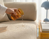 Spill-proof test on the S8 Sleeper Sofa Bed, with liquid spilled onto the fabric and visibly not absorbed.