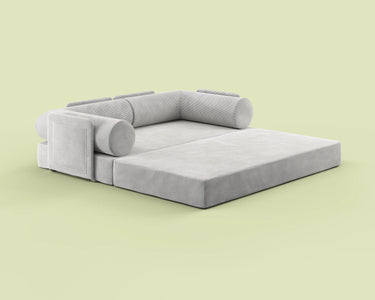Side view of the S8+ sofa bed in Comet Ivory, shown in king-size bed mode.