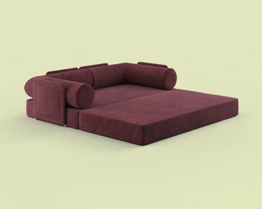 Side view of the S8+ sofa bed in Cosmic Wine, shown in king-size bed mode.