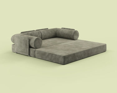 Side view of the S8+ sofa bed in Terraform Green, shown in king-size bed mode.