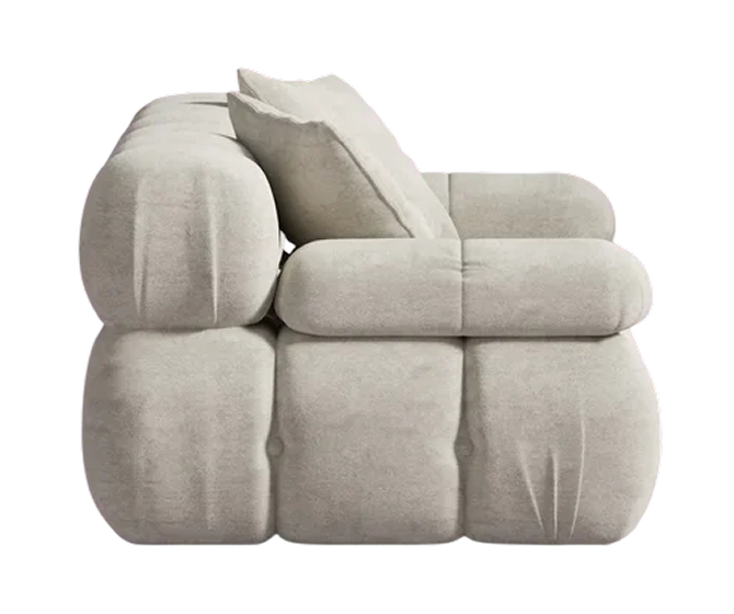 Modern beige sofa with a pillow on a white background